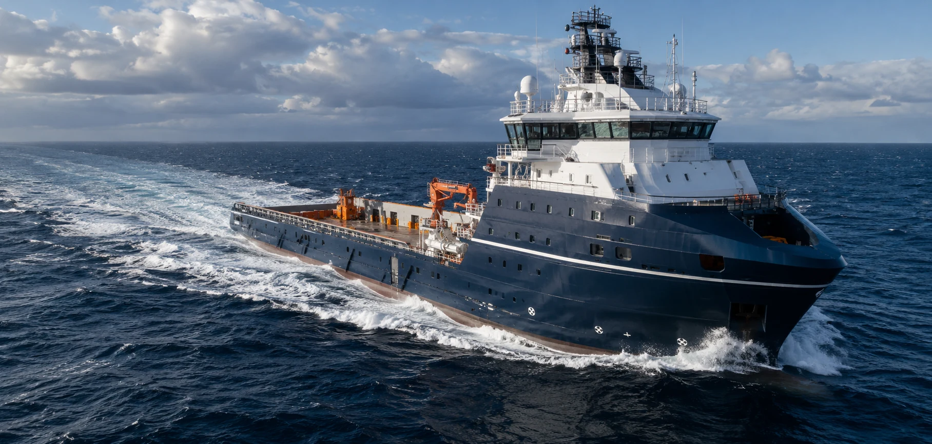 Modern offshore support vessel underway